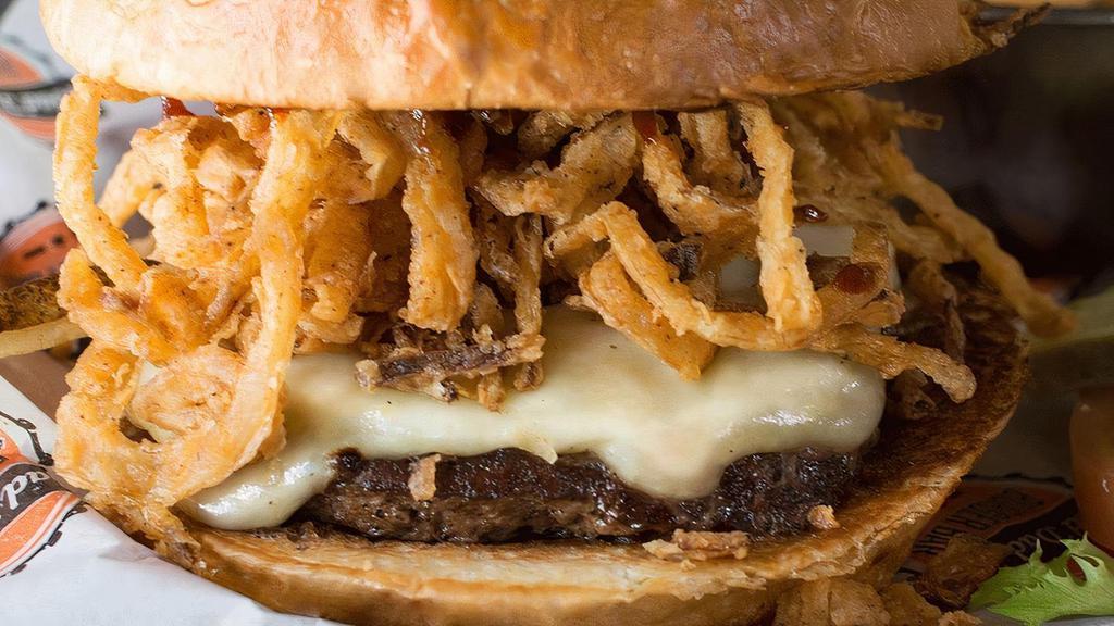 Western Burger* · 100% buffalo burger topped with Monterey Jack, seasoned fried onion straws & barbecue sauce