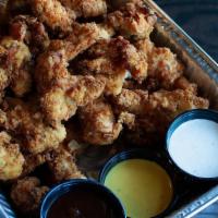 Chicken Tender Family Packs · A platter of our fresh hand-breaded chicken tenders served with BBQ, Honey Mustard & Ranch f...
