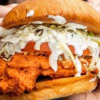 Buffalo Chicken · Crispy or grilled chicken breast tossed in buffalo sauce with blue cheese crumbles, our hous...