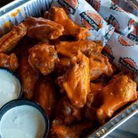 Wing Family Packs · A platter of fresh jumbo wings tossed in Buffalo, BBQ or Thai chili sauce. Served with a sid...