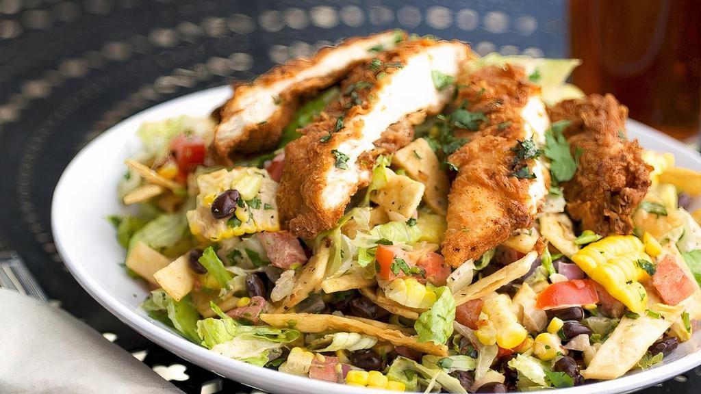 Texican Chicken Salad · Romaine lettuce, buttermilk-fried chicken breast, cilantro, red onion, tomato, black beans, corn & tortilla strips tossed in our housemade. chipotle ranch