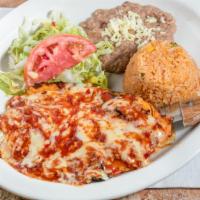 Pollo Ranchero · Boneless Chicken breast grilled and topped with ranchero sause. Served with rice, beans and ...