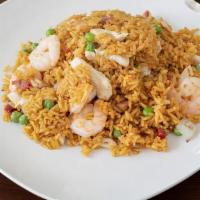 House Special Fried Rice · Stir fried yellow rice with roast pork, shrimp, chicken, onions and peas.