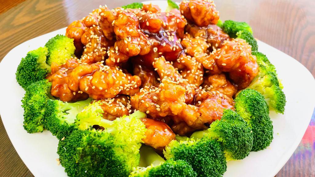 Sesame Chicken · Chicken with roasted sesame seeds in a savory sauce. With white rice.