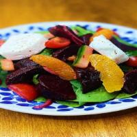 Bietole E Caprino · Roasted beets, goat cheese, spinach, organic baby heirloom tomatoes, cucumber, orange segment