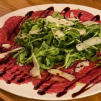 Manzo Carpaccio · Sliced beef, arugula, glazed balsamic vinegar, parmesan, olive oil