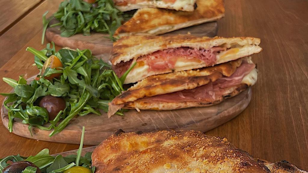 Prosciutto Crudo & Arugula · Sandwich, prosciutto crudo, mozzarella fior di latte, organic heirloom baby  tomatoes, arugula, olive oil