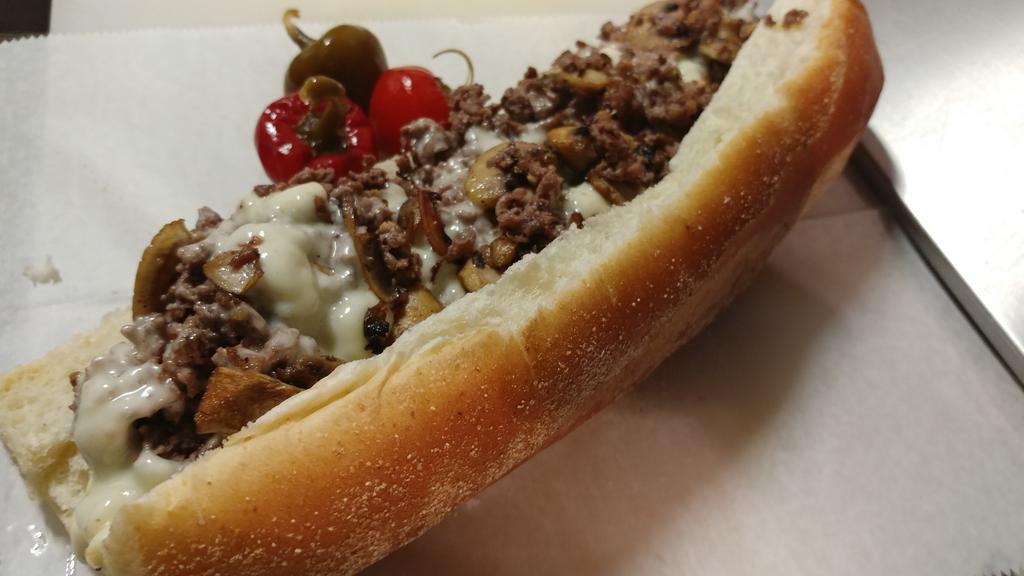 Cheese Steak · Genuine Rib-eye Steak, White American cheese, On a Steak Roll. Rib-Eye Steak seasoned and Grilled to perfection. It does not need too many toppings. Prepared Meat Cheese and Bread...