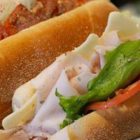 Turkey Hoagie · 100% All Natural Turkey Breast thinly sliced and piled high with L.T.O. your choice of chees...