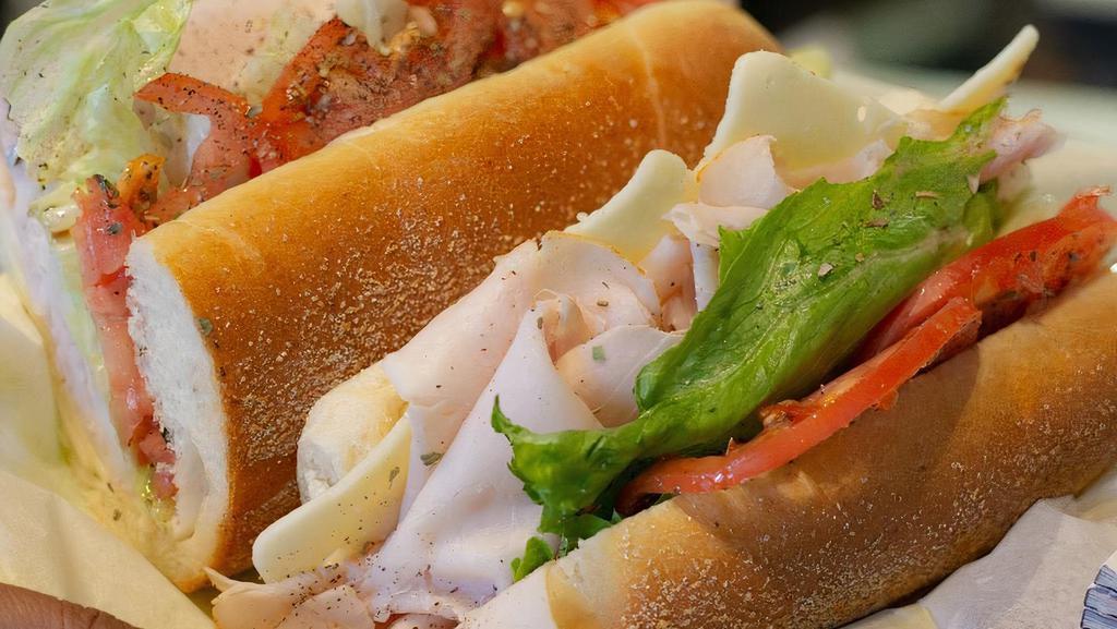 Turkey Hoagie · 100% All Natural Turkey Breast thinly sliced and piled high with L.T.O. your choice of cheese and Sweet or Hot peppers, maybe try it with some Honey-Mustard.