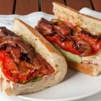 Turkey Club · Applewood Cured Bacon,  All Natural Turkey Breast, Lettuce, Tomato and Garlic Peppercorn May...