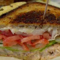 Tuna Melt · 100% Albacore Tuna, Melted Swiss Cheese, Lettuce & Tomato on Grilled Old Fashion Rye Bread.