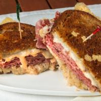 Classic Reuben · Top Round Corned Beef Thinly Sliced, Sauerkraut, Thousand Island and Melted Swiss Cheese on ...