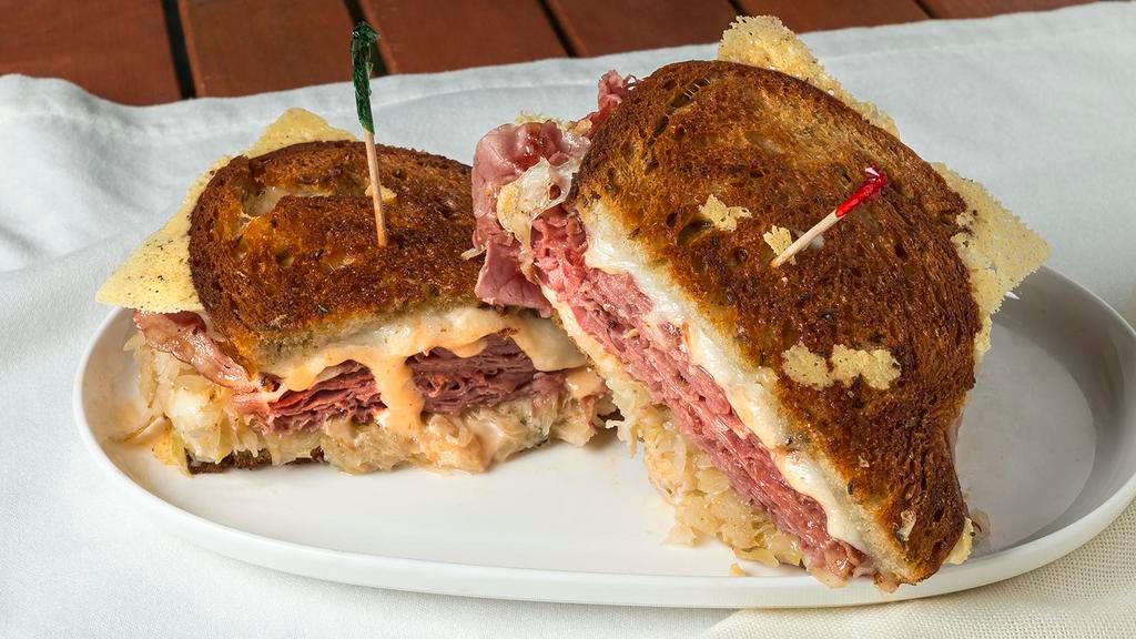 Classic Reuben · Top Round Corned Beef Thinly Sliced, Sauerkraut, Thousand Island and Melted Swiss Cheese on Grilled Old fashion rye.