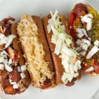 Slaw Dog · All beef frank, deli mustard, raw onions, homemade coleslaw Served on New England Style Dog ...
