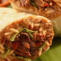 Griot Burrito · Freshly fried pork [Griot] wrapped in a warm flour tortilla with rice, beans, veggies, and t...