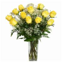 One Dozen Deluxe Yellow Roses · One dozen deluxe yellow roses, along with seasonal foliage, are designed tall oblong vase. O...