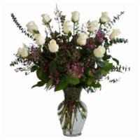 Ultimate Dozen White Roses · A dozen long-stemmed premium white roses are presented with premium foliage and eucalyptus i...