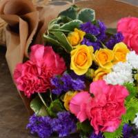 Radiant Rays · Delight your recipient with Radiant Rays - yellow spray roses, green buttons, and pink carna...