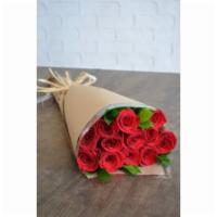 Moulin Rouge · A dozen classic red roses, presented along with seasonal greens. Wrapped in craft paper and ...