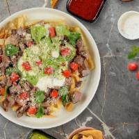 Guac My World Asada Fries  · (Vegetarian) Melted cheese, sour cream, guacamole, and housemade sauce topped on Idaho potat...