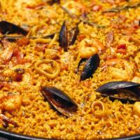 A Special Paella Valenciana · From valencia to your home, paella with calamari, shrimp, mussels and chicken.