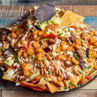 Jj’S Big Nachos For 3 · Served with blue tortilla chips, topped with Nicaraguan fried cheese, kidney beans, shredded...