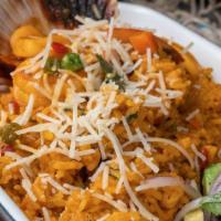 Arroz Con Mariscos · Seafood rice cooked in beer, “salsa criolla”