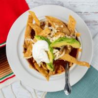 Tortilla Soup · Chicken and tomato based broth, fried tortilla strips, chopped onions, avocado slices, chees...