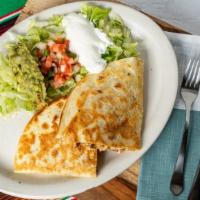 Super Fajita Quesadilla Grande · Oversized quesadilla stuffed with cheese and grilled chicken or steak. Served with lettuce, ...