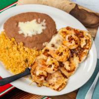 Pollo Jalisco · Grilled chicken with jumbo shrimp. Topped with cheese sauce. Served with rice and beans. * 
...