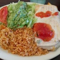 Chimichanga · Grilled steak or chicken served with lettuce, sour cream, guacamole, shredded cheese, tomato...