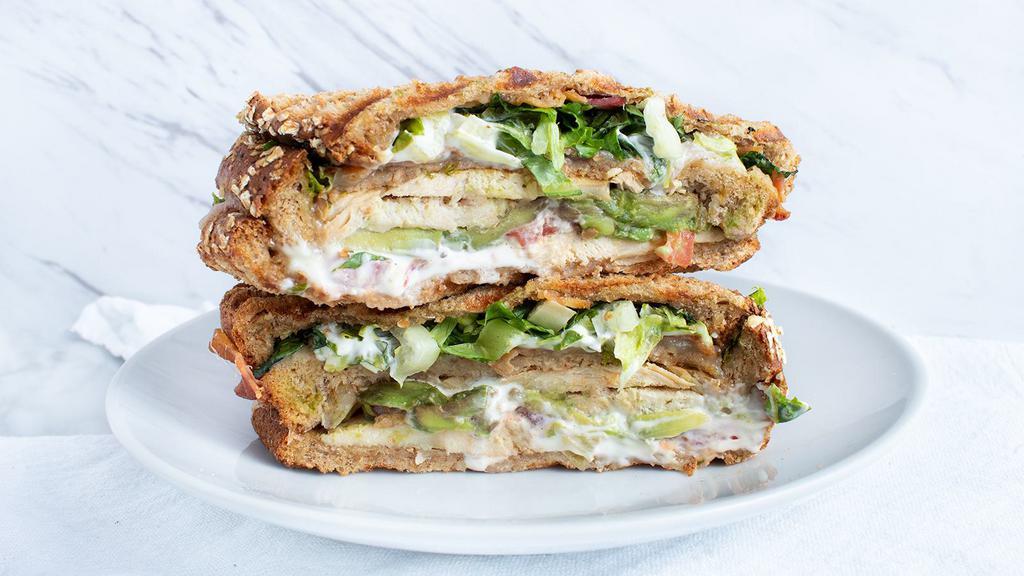 Chicken Club Sandwich · sliced multigrain, swiss cheese, bacon, tomato, avocado, lettuce & aioli dressing.