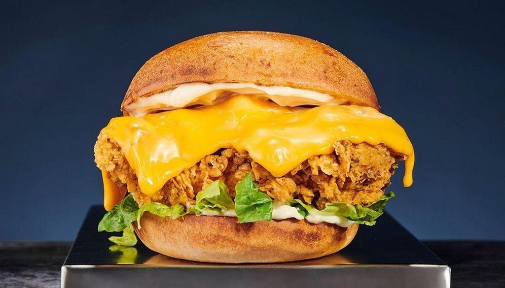 Classic Chicken Sandwich With Cheese · Crispy hand-breaded fried chicken sandwich with spicy mayo, lettuce and cheese.