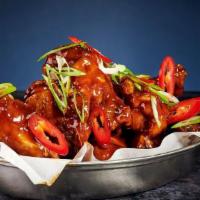 Korean Bbq Wings · Tossed in rich and sticky BBQ sauce, topped with spring onion and fresh chilli.
