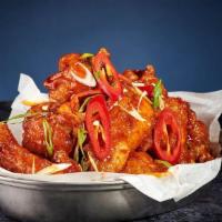 Chilli Bang Hot Wings 🌶 · Tossed in our signature chilli hot sauce, topped with spring onion and fresh chilli.