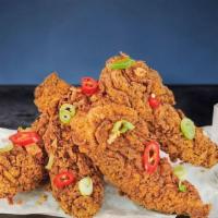Chilli Bang Tenders · Handed-breaded crispy chicken tenders, topped with spring onion, fresh chilli and chilli hot...