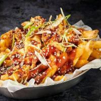 Korean Bbq Loaded Fries · Crispy fries layered with Korean BBQ sauce, cheese and garnished with spring onion & chilli.