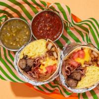 Lazy Loaded Breakfast Burrito · Two scrambled eggs with delicious chorizo, bacon, crispy home fries, melted cheese, tomatoes...