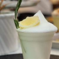 Frozen Lemonade · House-made lemonade placed into our frozen drink machine garnished with fresh thyme sprigs.