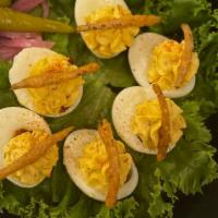 Deviled Eggs · topped with pimento cheese,  spicy remoulade & pickled red onion