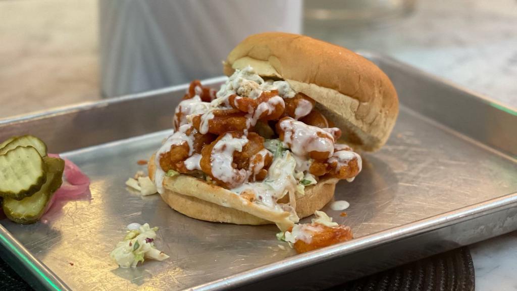 Buffalo Shrimp Sandwhich · Fried Shrimp tossed In our house-made Buffalo Sauce, served with Brussels Sprout Slaw Blue Cheese Crumbles & Ranch Dressing