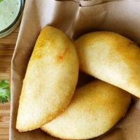 Venezuelan Beef  · Venezuelan Empanada filled with shredded beef.