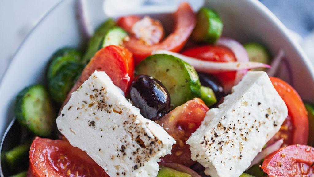 Greek Salad  · Lettuce, onion, tomato, kalamata olive, cucumber, feta cheese, olive oil & lime dresing