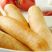 Italian Garlic Breadsticks (Full) · With cheese sauce for dipping.
