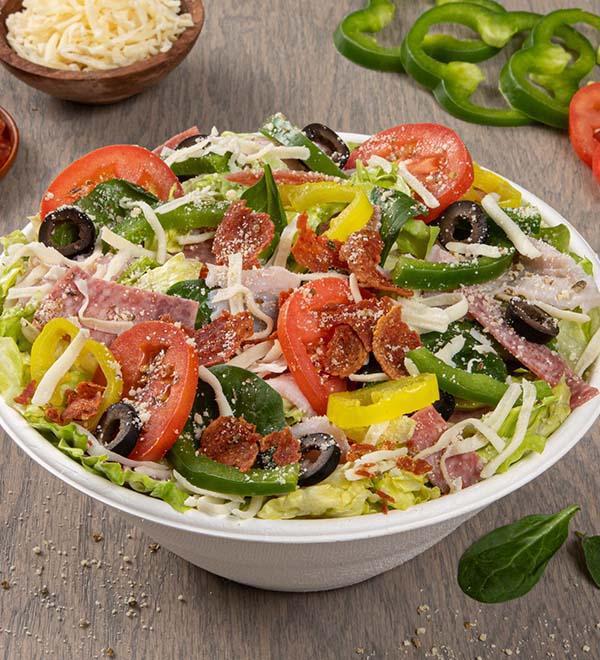Italian Chef Salad (Entree) · Heritage pepperoni, shaved ham, sliced salami, freshly cut Roma tomatoes, green peppers, banana peppers, black olives, smoked Provolone, Romano. Served with House Italian dressing.