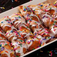 Party Twists (Full) · Sweet and delicious pull-apart twists, served warm, drizzled with vanilla icing, and topped ...