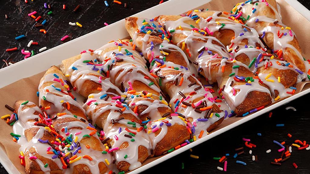 Party Twists (Full) · Sweet and delicious pull-apart twists, served warm, drizzled with vanilla icing, and topped with rainbow sprinkles. Serves 4.