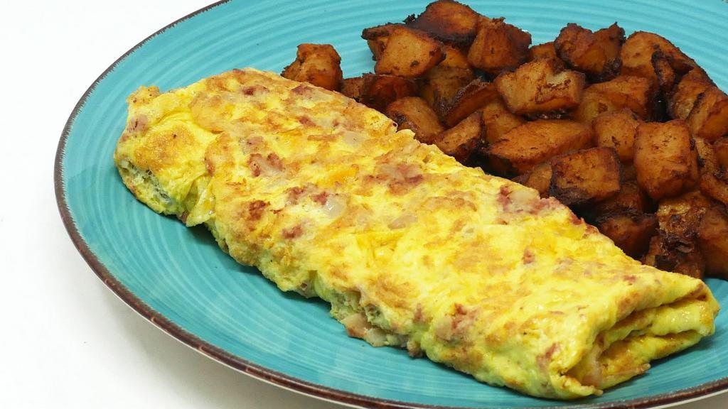 Corned Beef Hash Omelette · A 3 Egg Omelette with our Signature Corned Beef Hash!