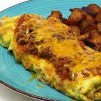 Chili & Cheese Omelette · A 3 egg Omelette topped and filled with our Homemade Chili and Cheddar cheese! Served with a...
